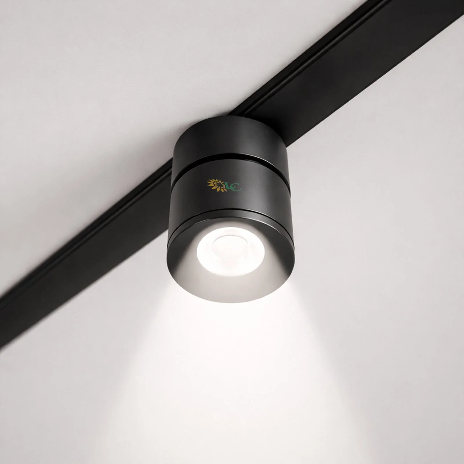 LED ceiling spotlight for modern lighting design, installed on a white ceiling with black track.
