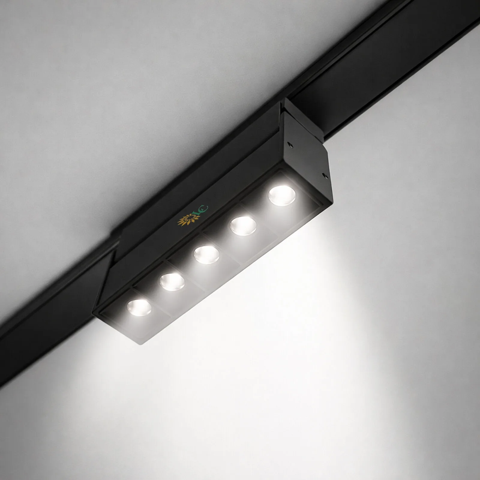Modern LED track lighting fixture with four adjustable lights for home or commercial use.
