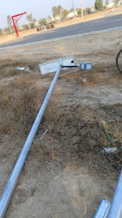 Solar street lights installed in residential housing society road providing energy efficient outdoor lighting